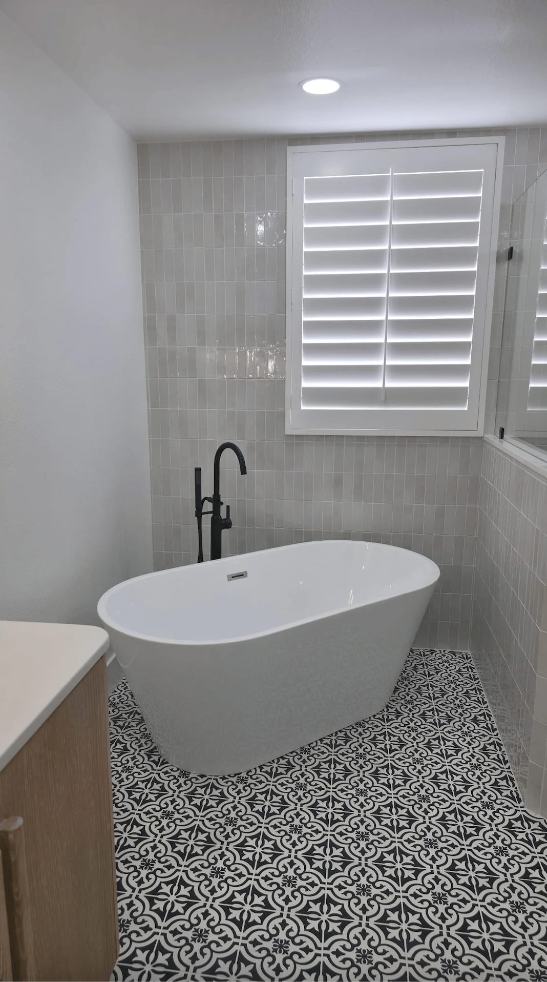 Marble bathroom retreat with radiant floors and bespoke vanities